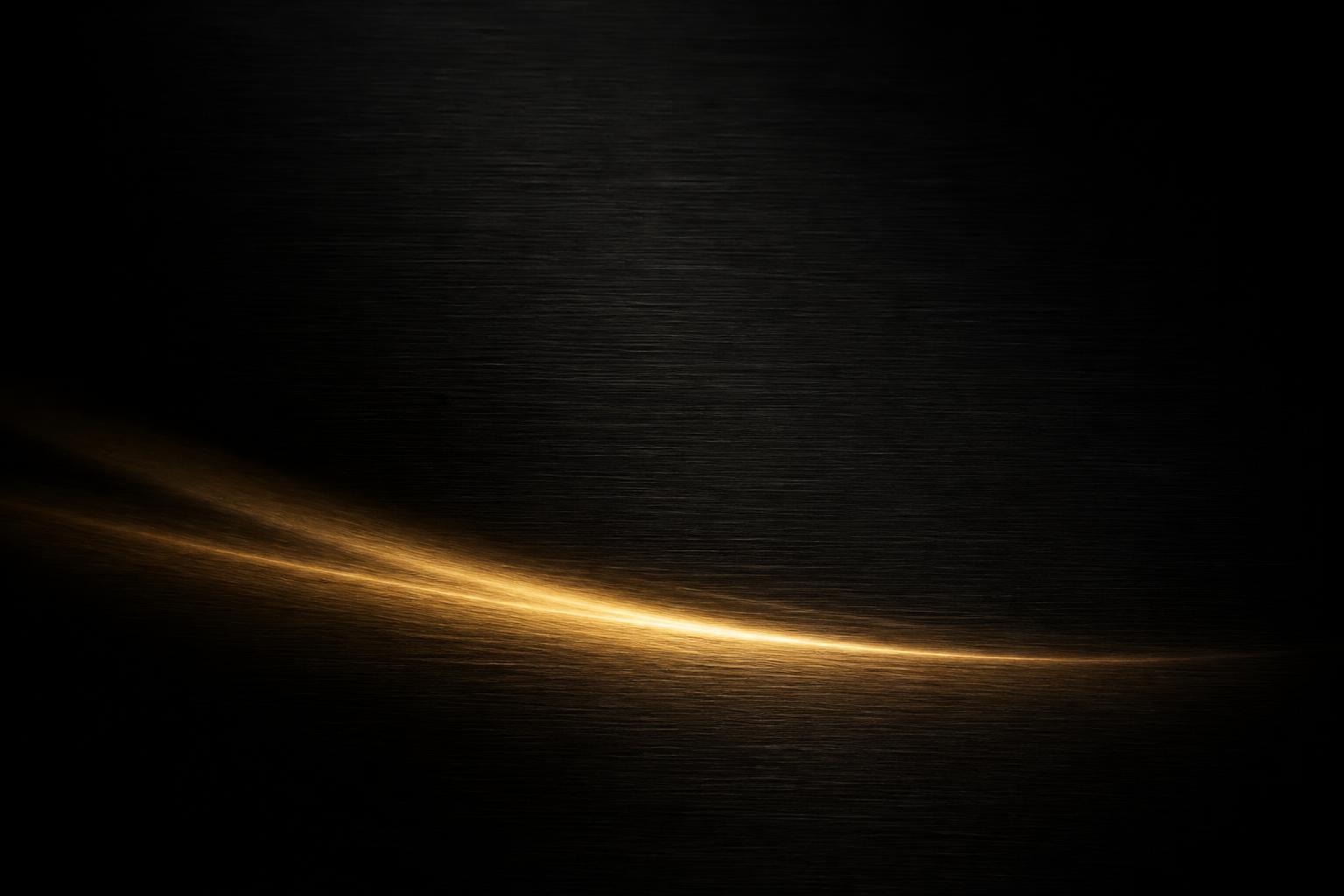 Black surface with a gold light sweep